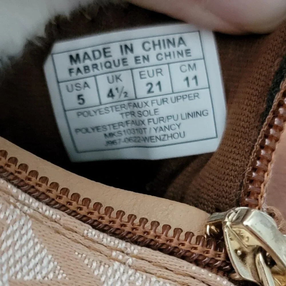 Michael Kors Yancy Girl Toddler boots featuring a brown logo print and faux fur